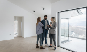 two tenants and a landlord after a successful tenant background check