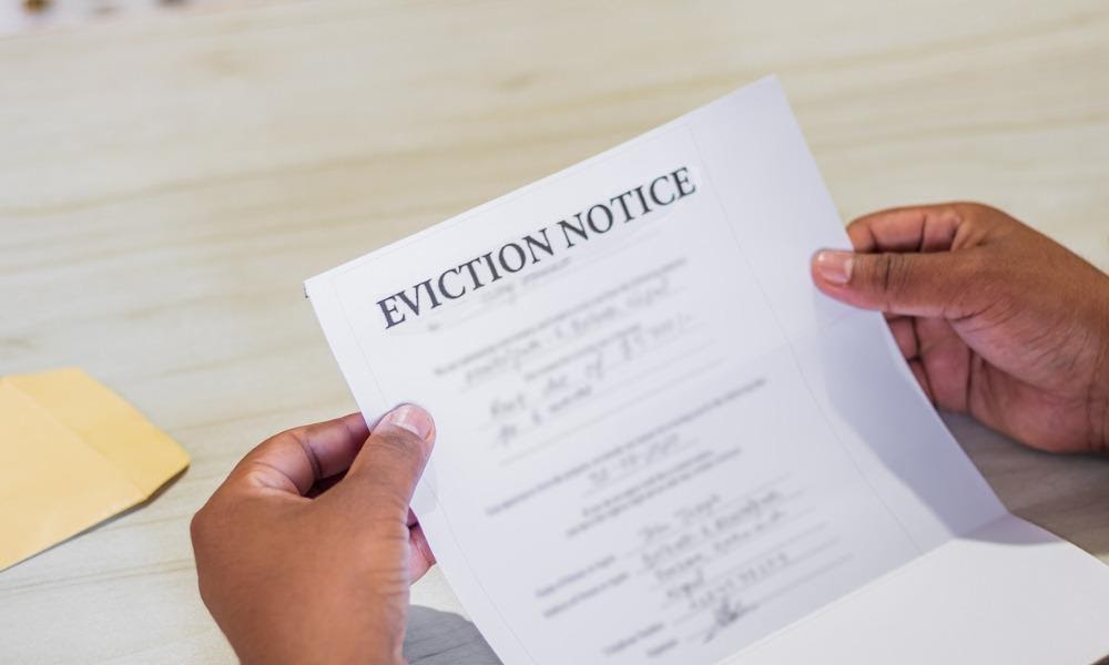 A problem tenant reads the eviction notice sent by the landlord
