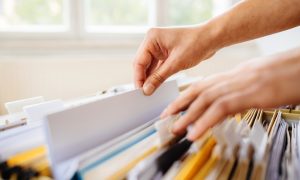 a landlord sorting through their essential documents